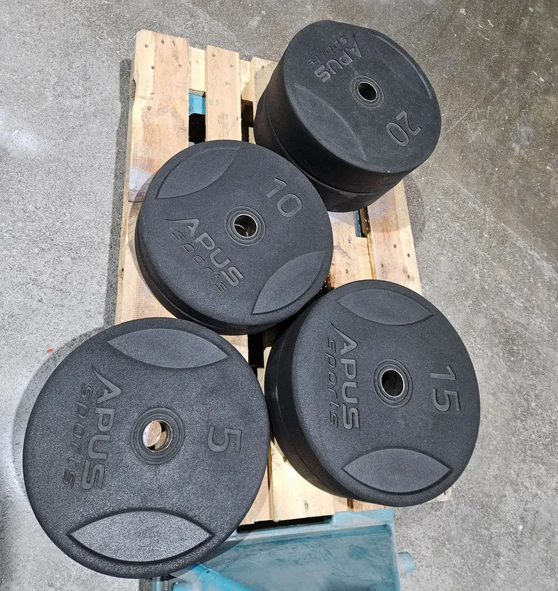 Set 100kg Bumper Plates von Apus Sports - 2x 20kg, 2x 15kg, 2x 10kg und 2x 5kg, Hantelscheiben 50mm Durchmesser aus Granulat gepresst in Schwarz, gebraucht - mit Gebrauchsspuren